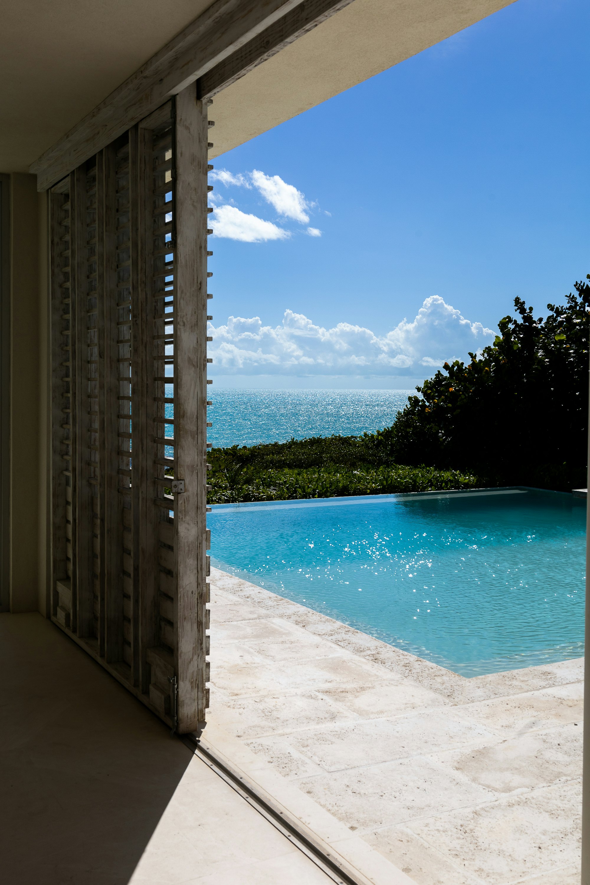 Terrace and infinity pool opening to the Pacific at Casa Luzia
