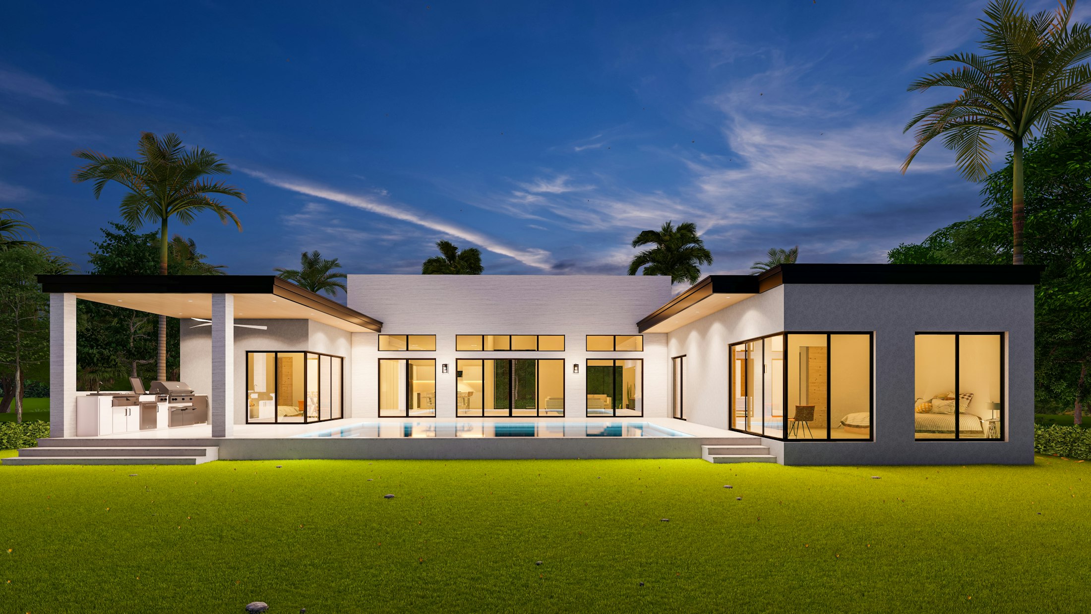 Casa Mirador at dusk — a long, low volume with its living level lit from within