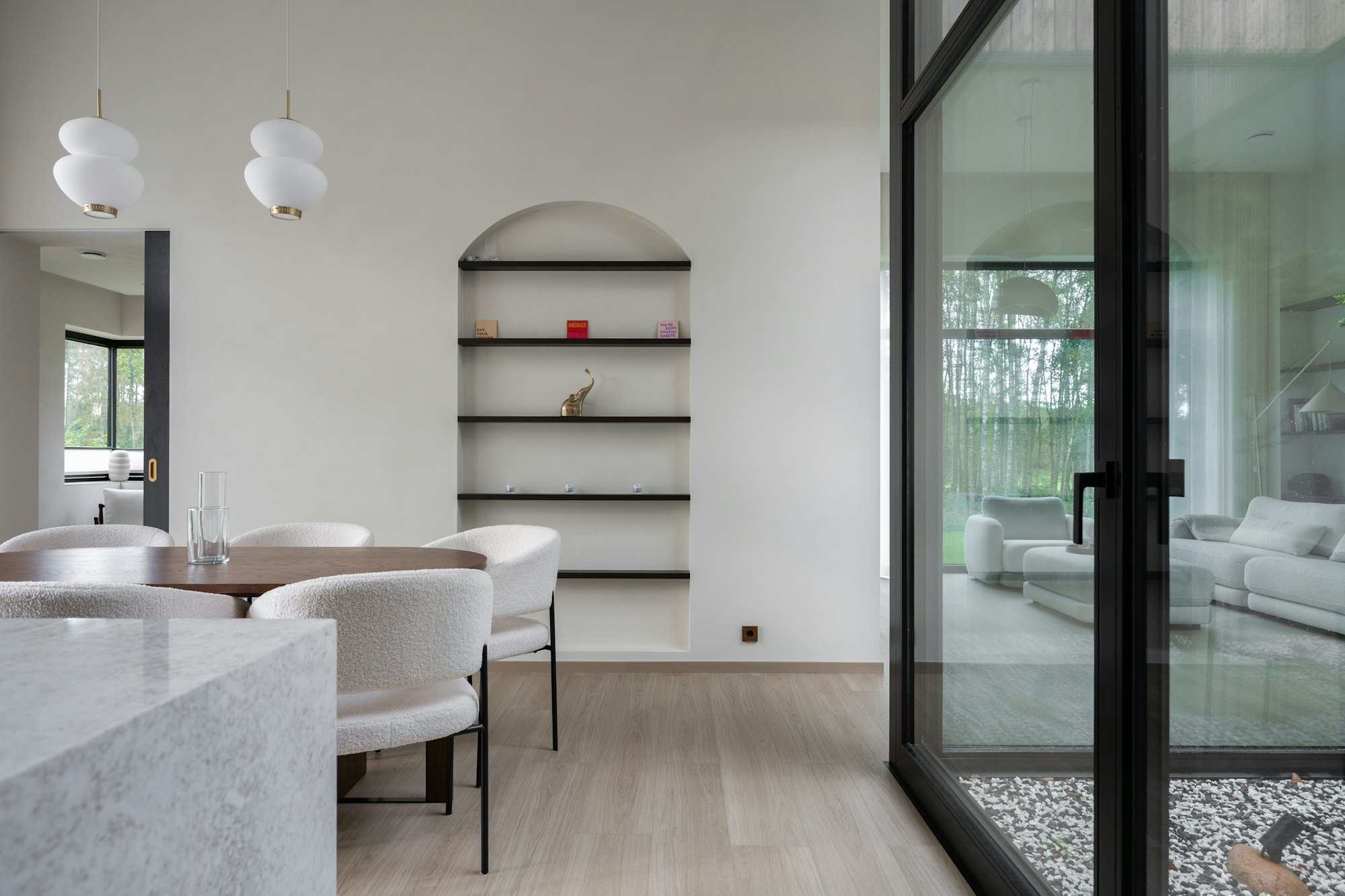 Dining area with built-in joinery and tall west-facing windows