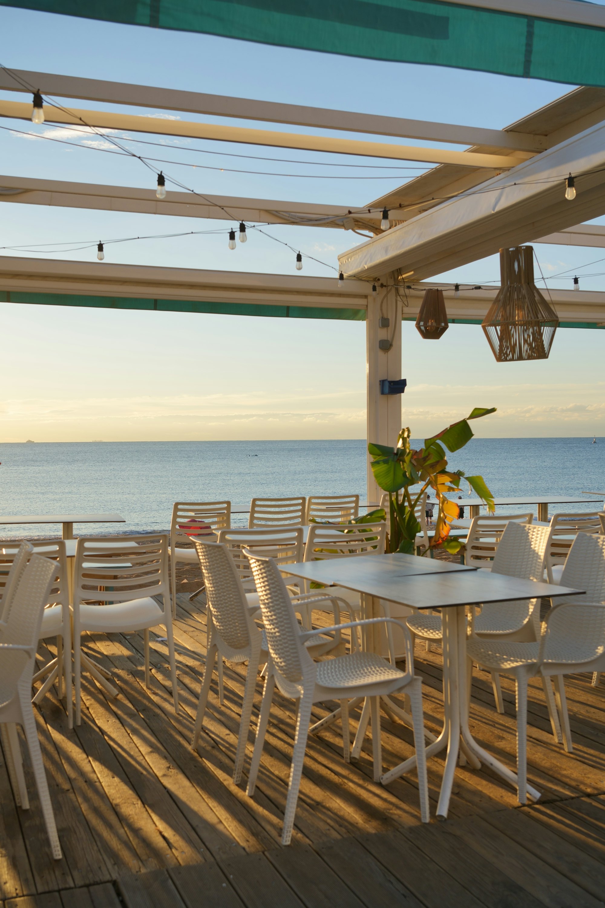 Outdoor dining terrace facing the sea