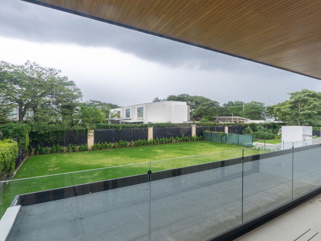 Balcony above the garden, looking across the neighbouring treeline