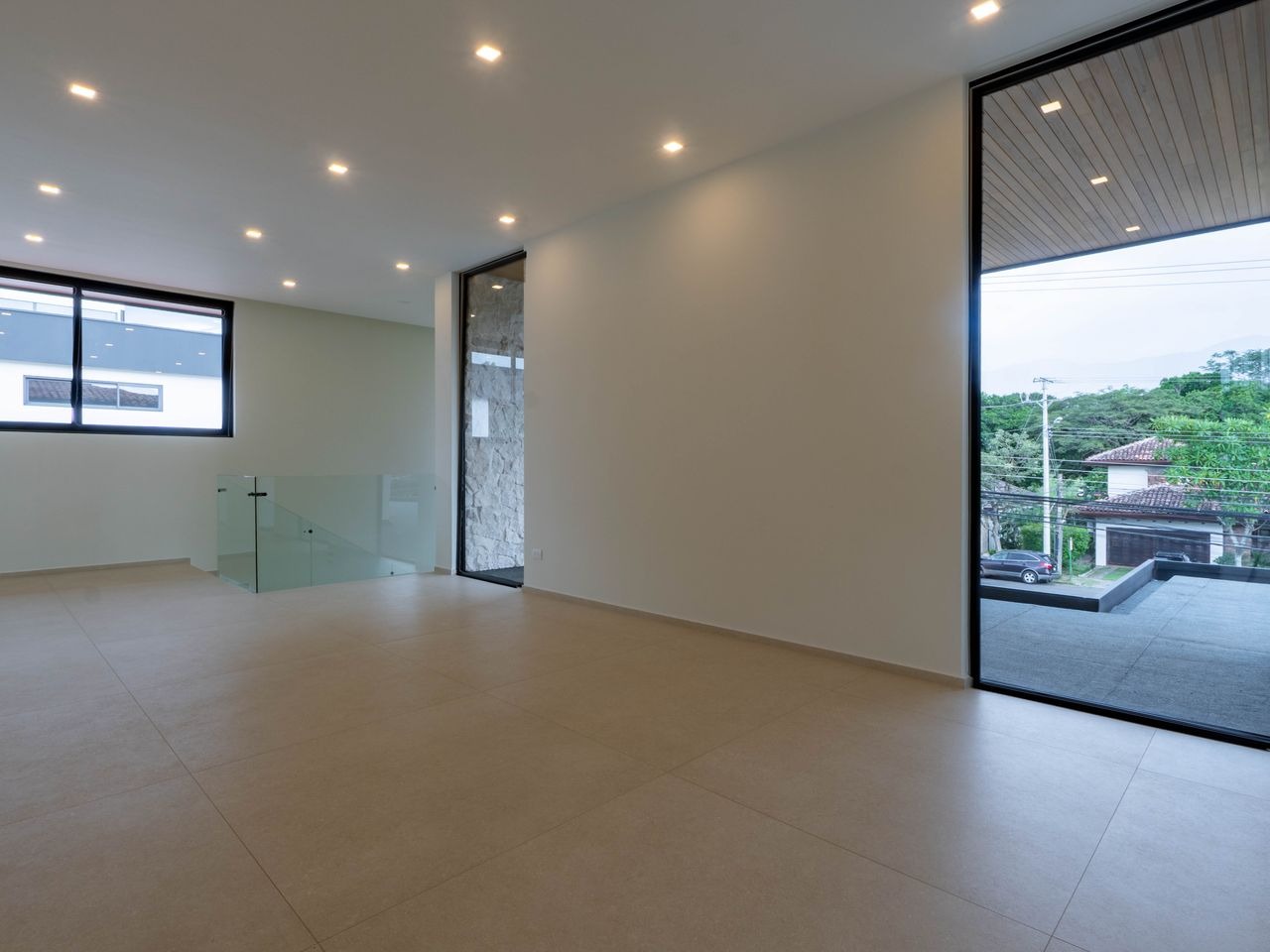 The upstairs television room, open to the stairwell