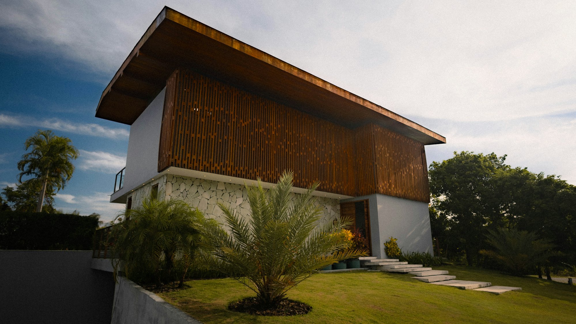 Long timber-roofed house with deep eaves in Guanacaste dry forest