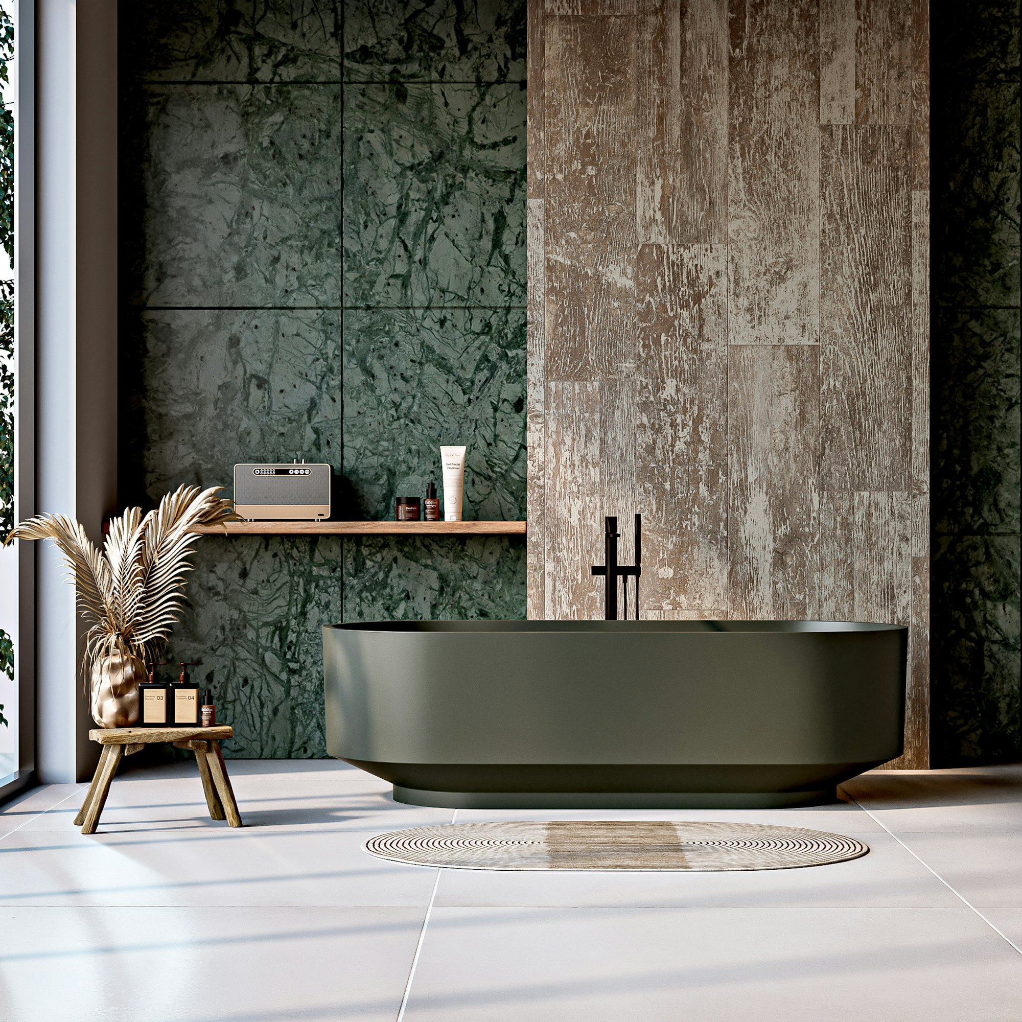 Bathroom finished in green marble with a freestanding tub